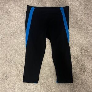 Sleek Black Leggings with Vibrant Blue Stripes